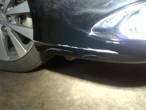 Badly scraped bumper