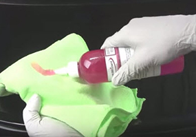applying chemical to towel
